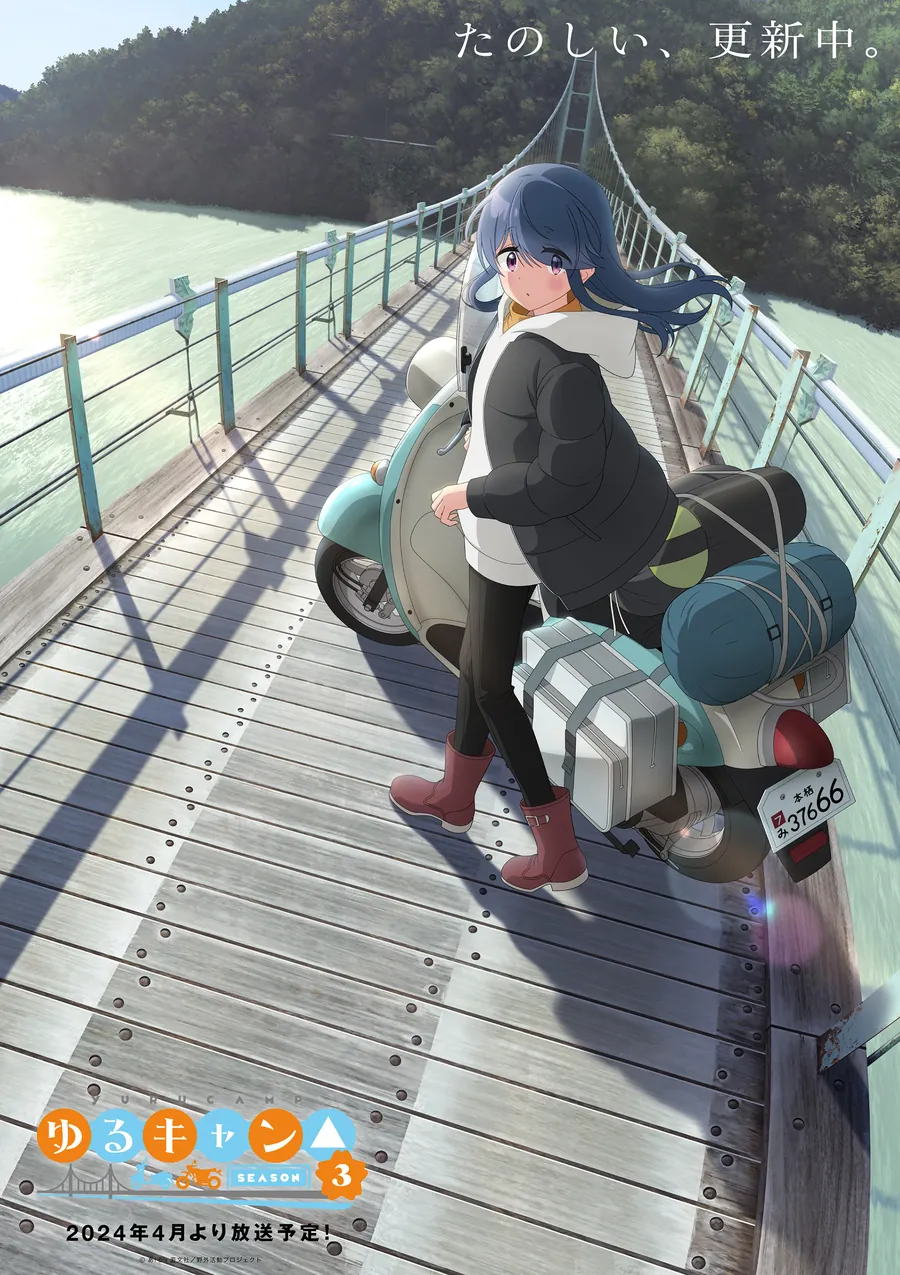 Rin with her loaded scooter on a long suspension bridge over a green lake