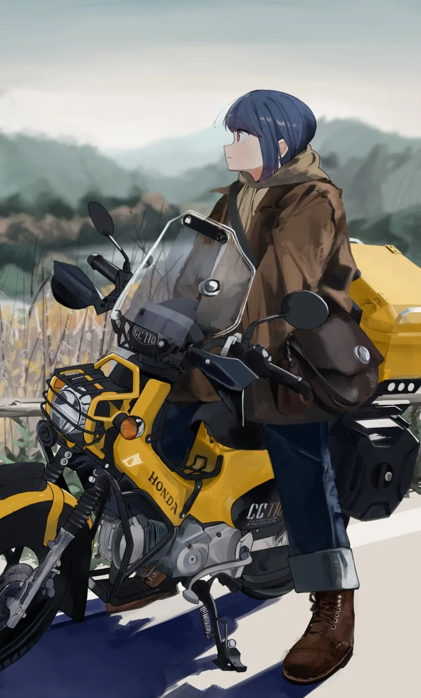 Rin leaning on a yellow touring motorbike, looking out over the hills